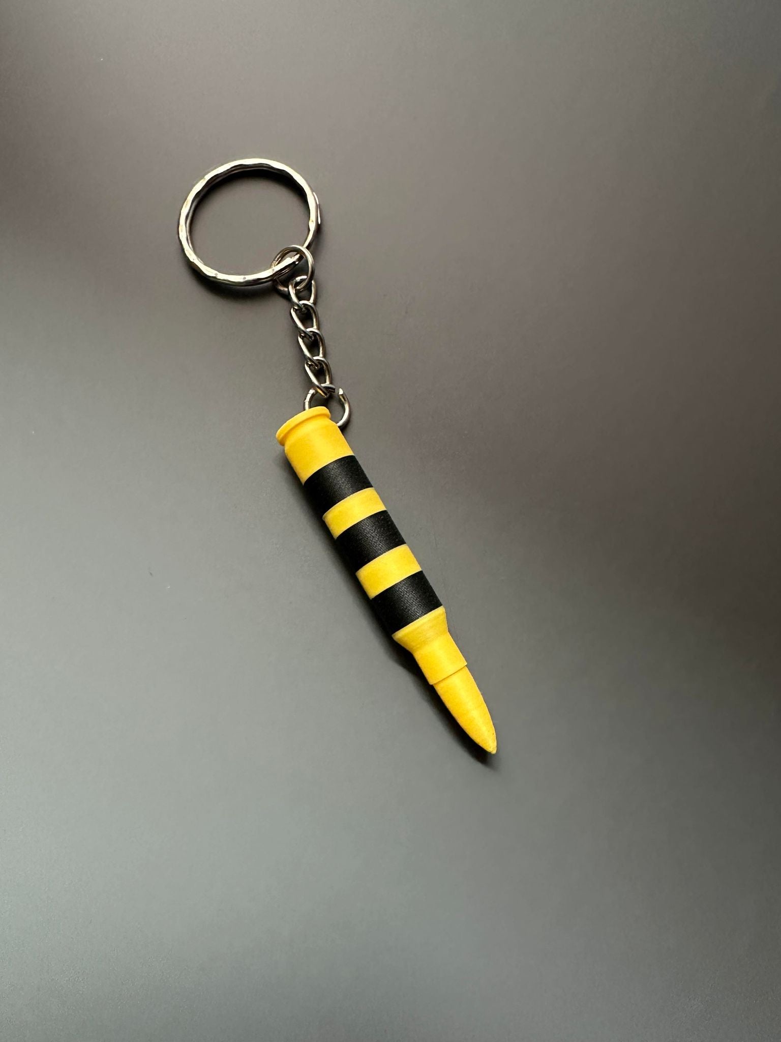 Rust 5.56 Explosive Bullet Keychain – That Prints